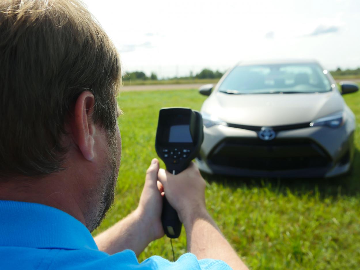 thermal engineer point a flir infrared camera at toyota camary hood for field test