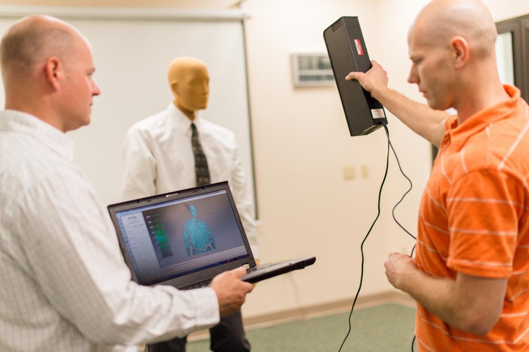 ThermoAnalytics engineers performing human thermal comfort testing with a manikin