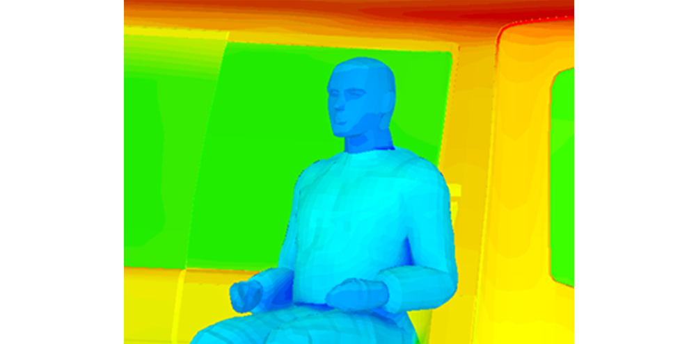 3D thermal simulation of a seated human figure in a room, with cooler blues on the body and warmer yellow-red surroundings.